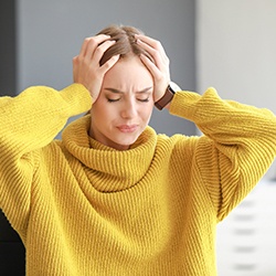 Woman experiencing headache pain