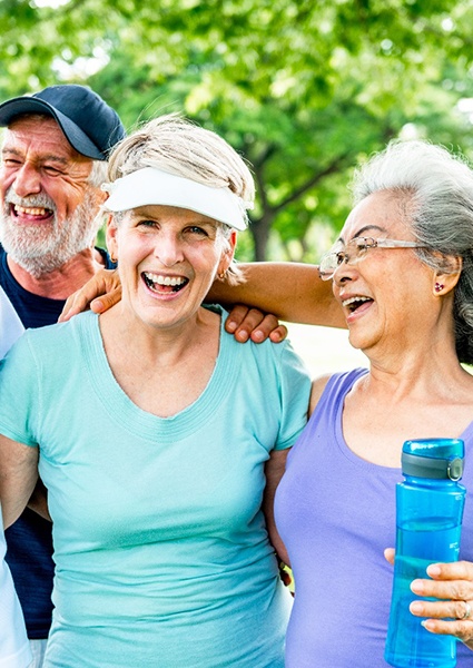 Happy older adults wearing workout gear