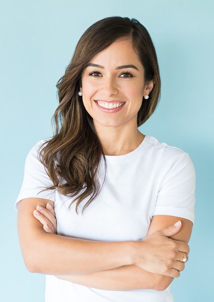 Woman in white t-shirt, wearing big smile