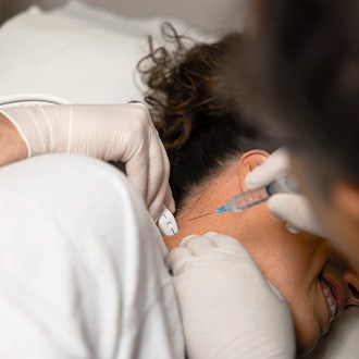 Doctor administering an interventional spine injection