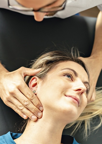 Doctor examining patient and reviewing holistic medical options