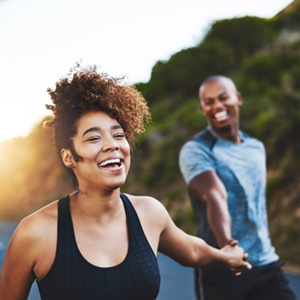 Happy couple exercising outdoors